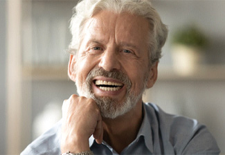 satisfied man with dentures in Leawood